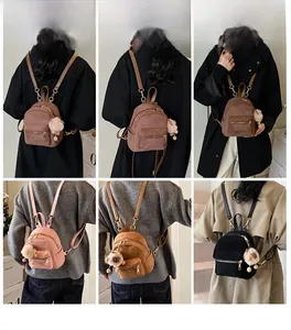 Mini corduroy backpack detail showing multiple colors and cute pompom keychain accessory
