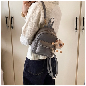 Mini dark gray matte backpack with front zipper pocket and cute teddy bear pendant charm