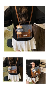 Detail of denim and brown leather patchwork bag with cute teddy bear charm