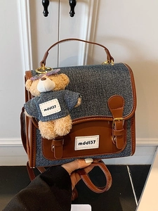 Retro denim backpack with brown leather trim and cute teddy bear charm for women