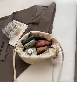 Internal view of cream drawstring cloud bag showing large storage space for essentials