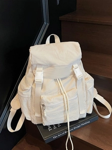 Minimalist beige large capacity campus backpack with flap buckle and drawstring closure