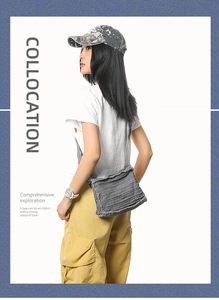 Detail of grey canvas crossbody bag with layered pleated folds and raw fringe edges