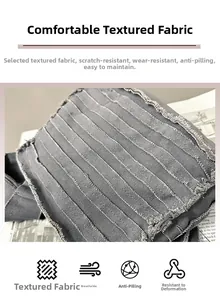 Detail of grey textured fabric with stripe pleats and fringe edges on a small crossbody bag