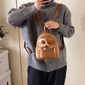 Brown faux suede mini backpack with plush sheep charm and adjustable leather straps