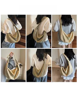 Detail of solid color canvas dumpling bag with adjustable wide straps and knot design