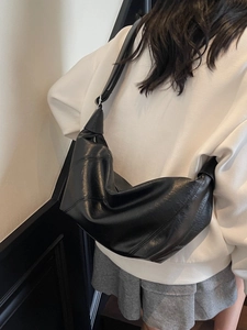 Minimalist black soft faux leather shoulder bag with spacious slouchy hobo design