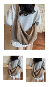 Close-up of deep brown crescent bag with pleated details and wide strap for a casual look