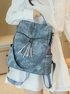 Blue soft PU leather backpack for women with textured stone pattern and decorative tassels