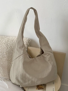 Minimalist large capacity khaki tote bag with wide shoulder strap for daily commuting