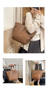 Detail of brown litchi pattern leather tote bag with adjustable silver metal buckles