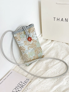 Crossbody mini phone bag with traditional blue jacquard fabric and mountain scenery pattern