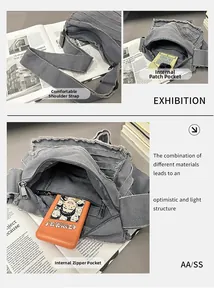 Detail view of grey denim crossbody bag with frayed edges and wide shoulder strap