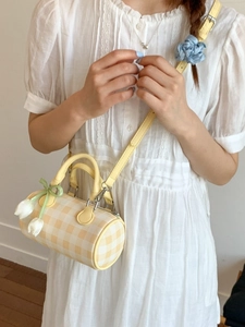 Fashionable yellow and white checkered cylinder crossbody bag with tulip charm and scrunchie