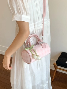 Pink and white checkered Boston bag with tulip charm and adjustable crossbody strap