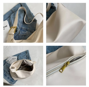 Detail view of cream PU leather hobo bag showing litchi texture and gold metal buckle