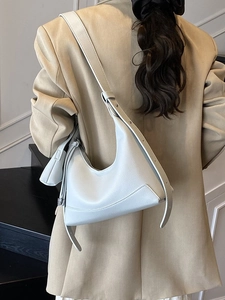 Minimalist light grey pebble leather crescent bag with adjustable wide shoulder strap