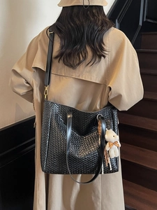 Vintage black woven leather tote bag with shoulder strap and bear charm for women