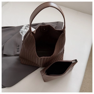 Detailed view of dark brown woven tote bag set with a matching zipper inner pouch