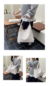 Detailed view of cream woven hobo shoulder bag with large capacity and soft PU leather texture