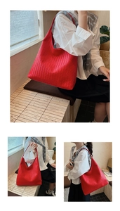 Detailed close-up of large red woven tote bag featuring classic intricate leather patterns