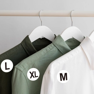 Adhesive size labels for shirts showing M, L, XL on cotton linen button-down tops