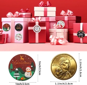 Detailed view of 1-inch Christmas stickers on gift box with coin for size reference