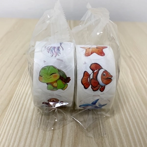 Bulk rolls of ocean animal stickers showing turtle, shark, and jellyfish patterns in packaging