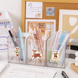 Detail of clear acrylic pen holder featuring festive Merry Christmas deer stickers