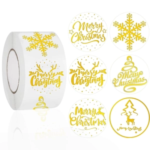 Roll of Christmas Merry Christmas gold foil stickers with snowflake and reindeer designs