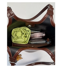 Interior view of brown crocodile texture tote bag showing large capacity and magnetic closure