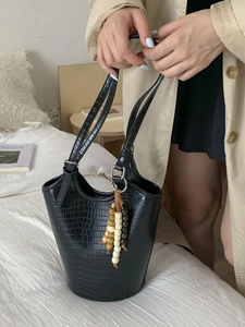 Minimalist black crocodile pattern tote bag with decorative bohemian wooden beads pendant