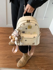 Cream PU leather backpack with vintage monogram pattern and pink plush charm