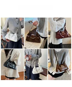 Detail view of four vintage pleated hobo bags in white, brown, red, and black leather