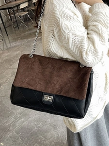 Classic colorblock quilted tote with silver chain strap and metal turn-lock clasp on a model