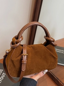 Brown suede dumpling cloud bag with pleated top handle and adjustable shoulder strap