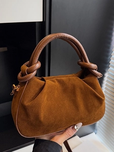 Brown suede Boston dumpling bag with pleated details and knotted top handle for women
