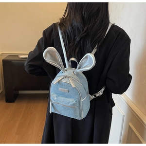 Mini light blue glitter backpack with silver bunny ears detail and adjustable straps