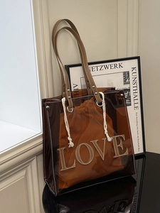 Braune transparente PVC-Tasche mit LOVE-Patch und orangefarbenem Innentasche