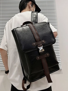 Fashionable black PU leather laptop backpack with silver buckle and brown strap accents