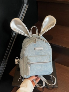 Vintage light blue denim mini backpack with silver rabbit ears and rhinestone accents