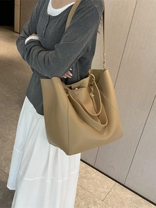 Retro minimalist khaki bucket tote bag with adjustable shoulder strap for daily commuting