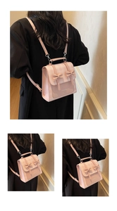 Detailed back view of a pink plaid backpack with bow accents and adjustable straps