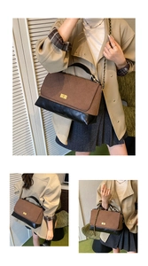Detailed view of retro quilted contrasting shoulder bag showcasing fine chain strap and turn-lock.