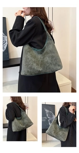 Detalle del bolso hobo de ante verde oscuro con costuras en contraste y correa ancha