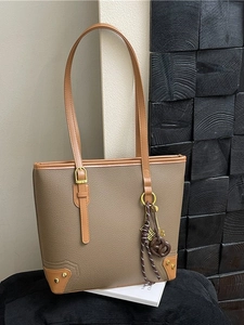 Large taupe lychee leather tote bag with brown straps and gold hardware details