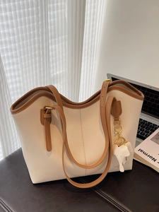 Minimalist large tote bag in beige and brown with cute elephant charm for daily commute
