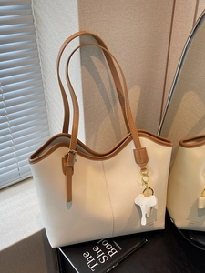 Retro large capacity tote bag in cream PU leather with brown straps and elephant charm
