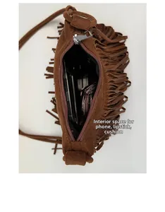 Top view of bohemian tassel crossbody bag interior space showing phone and cosmetics
