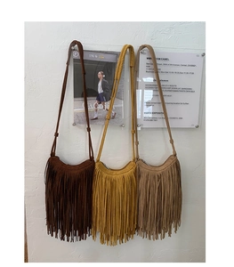 Three bohemian crossbody bags with long fringe tassels in coffee yellow and khaki colors